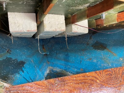 Foredeck where the fuel tank needs to be mounted. $1099 bought this boat in 1966; all pretty rudimentary though, exposed wood, strips of cardboard on the deck beams and polystyrene bouyancy. Pop rivets hold the deck and hull together.